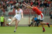 28 June 2014; Connor McAliskey, Tyrone, scoring a point despite the attention of John Bingham, Louth. GAA Football All Ireland Senior Championship, Round 1B, Tyrone v Louth, Healy Park, Omagh, Co. Tyrone. Picture credit: Oliver McVeigh / SPORTSFILE