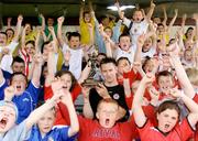 6 July 2006; Children attending the Sligo Rovers Soccer Summer Camp celebrate with striker Paul McTiernan who was presented with the eircom / Soccer Writers Player of the Month for June. Showgrounds, Sligo. Picture issued on behalf of Brian Farrell by SPORTSFILE