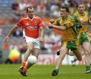 9 July 2006; Martin O'Rourke, Armagh, in action against Eamonn McGee, Donegal. Bank of Ireland Ulster Senior Football Championship Final, Donegal v Armagh, Croke Park, Dublin. Picture credit: Ray McManus / SPORTSFILE