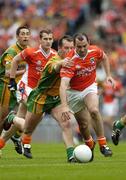 9 July 2006; Martin O'Rourke, Armagh, in action against Karl Lacey, Donegal. Bank of Ireland Ulster Senior Football Championship Final, Donegal v Armagh, Croke Park, Dublin. Picture credit: Ray McManus / SPORTSFILE