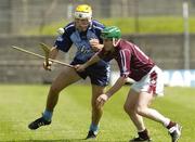 15 July 2006; David Curtin, Dublin, in action against Pat Clarke, Westmeath. Guinness Senior Hurling Championship, Relegation Final, Dublin v Westmeath, O'Connor Park, Tullamore, Co. Offaly. Picture credit: Pat Murphy / SPORTSFILE