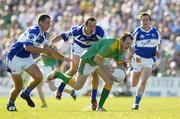 15 July 2006; Joe Sheridan, Meath, in action against Darren Rooney, left, Tom Kelly, centre, and Chris Conway, Laois. Bank of Ireland All-Ireland Senior Football Championship Qualifier, Round 3, Meath v Laois, Pairc Tailteann, Navan, Co. Meath. Picture credit: Brendan Moran / SPORTSFILE