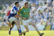 15 July 2006; Nigel Crawford, Meath, in action against Padraig McMahon, Laois. Bank of Ireland All-Ireland Senior Football Championship Qualifier, Round 3, Meath v Laois, Pairc Tailteann, Navan, Co. Meath. Picture credit: Brendan Moran / SPORTSFILE