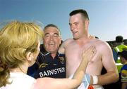 15 July 2006; Longford manage rLuke Dempsey celebrates after the final whistle with his player Liam Keenan and a fan. Bank of Ireland All-Ireland Senior Football Championship Qualifier, Round 3, Longford v Derry, Pearse Park, Longford. Picture credit: Matt Browne / SPORTSFILE