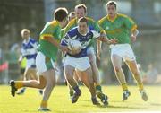 15 July 2006; Billy Sheehan, Laois, in action against Joe Sheridan and Nigel Crawford, Meath. Bank of Ireland All-Ireland Senior Football Championship Qualifier, Round 3, Meath v Laois, Pairc Tailteann, Navan, Co. Meath. Picture credit: Brendan Moran / SPORTSFILE