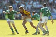 15 July 2006; David Fogarty, Wexford, in action against Fermanagh players from left, Mark Murphy, Adrian Little and Raymond Johnston. Bank of Ireland All-Ireland Senior Football Championship Qualifier, Round 3, Fermanagh v Wexford, Brewster Park, Enniskillen, Co. Fermanagh. Picture credit: Damien Eagers / SPORTSFILE