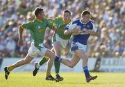 15 July 2006; Brian McCormack, Laois, in action against Niall McLoughlin, left, and Nigel Crawford, Meath. Bank of Ireland All-Ireland Senior Football Championship Qualifier, Round 3, Meath v Laois, Pairc Tailteann, Navan, Co. Meath. Picture credit: Brendan Moran / SPORTSFILE