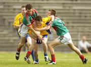 16 July 2006; Conor Devaney, Roscommon, in action against Tom Parsons, left, and Anthony Murray, Mayo. ESB Connacht Minor Football Championship Final, Mayo v Roscommon, McHale Park, Castlebar, Co. Mayo. Picture credit: Pat Murphy / SPORTSFILE