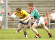 16 July 2006; Kevin Higgins, Roscommon, in action against Liam Tunney, Mayo. ESB Connacht Minor Football Championship Final, Mayo v Roscommon, McHale Park, Castlebar, Co. Mayo. Picture credit: Pat Murphy / SPORTSFILE