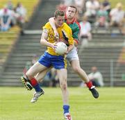 16 July 2006; Kevin Higgins, Roscommon, in action against Liam Tunney, Mayo. ESB Connacht Minor Football Championship Final, Mayo v Roscommon, McHale Park, Castlebar, Co. Mayo. Picture credit: Damien Eagers / SPORTSFILE