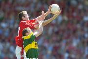 16 July 2006; Nicholas Murphy, Cork, fields a high ball ahead of Seamus Moynihan, Kerry. Bank of Ireland Munster Senior Football Championship Final Replay, Cork v Kerry, Pairc Ui Chaoimh, Cork. Picture credit: Brendan Moran / SPORTSFILE