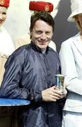 16 July 2006; Kieren Fallon with his trophy after winning the Darley Irish Oaks Race. The Curragh Racecourse, Co. Kildare. Picture credit: Peter Mooney / SPORTSFILE