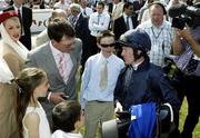 16 July 2006; Aidan O'Brien his son Donncha, in the centre, congratulates Kieren Fallon after the victory of Alexandrova in the Darley Irish Oaks Race. The Curragh Racecourse, Co. Kildare. Picture credit: Peter Mooney / SPORTSFILE