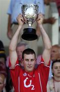 16 July 2006; Cork captain Darren Dinneen lifts the cup after the game. Munster Intermediate Hurling Championship Final, Cork v Tipperary, Pairc Ui Chaoimh, Cork. Picture credit: Brendan Moran / SPORTSFILE