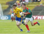 16 July 2006; Michael Sweeney, Mayo, in action against Conor Devaney, Roscommon. ESB Connacht Minor Football Championship Final, Mayo v Roscommon, McHale Park, Castlebar, Co. Mayo. Picture credit: Damien Eagers / SPORTSFILE