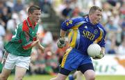 16 July 2006; Roscommon goalkeeper Mark Miley in action against Michael Sweeney, Mayo. ESB Connacht Minor Football Championship Final, Mayo v Roscommon, McHale Park, Castlebar, Co. Mayo. Picture credit: Damien Eagers / SPORTSFILE