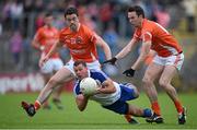 28 June 2014; Padraig Donaghy, Monaghan, in action against Aidan Forker, left, and Tony Kernan, Armagh. Ulster GAA Football Senior Championship, Semi-Final, Armagh v Monaghan, St Tiernach's Park, Clones, Co. Monaghan. Picture credit: Brendan Moran / SPORTSFILE