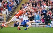 28 June 2014; Kieran Hughes, Monaghan, in action against Finnian Moriarty, Armagh. Ulster GAA Football Senior Championship, Semi-Final, Armagh v Monaghan, St Tiernach's Park, Clones, Co. Monaghan. Picture credit: Ramsey Cardy / SPORTSFILE