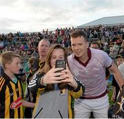 28 June 2014; Kilkenny's Walter Walsh poses for a 'selfie' with a fan after the game. Leinster GAA Hurling Senior Championship, Semi-Final Replay, Kilkenny v Galway, O'Connor Park, Tullamore, Co. Offaly. Picture credit: Piaras Ó Mídheach / SPORTSFILE