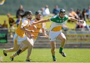 29 June 2014: Conor Mahon, Offaly, in action against Odhran McFadden and Tomas McCann, Antrim. GAA Hurling All-Ireland Senior Championship, Round 1, Antrim v Offaly, Ballycastle, Co. Antrim. Picture credit: Oliver McVeigh / SPORTSFILE