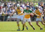 29 June 2014: Neal McAuley, Antrim, in action against Brian Carroll, Offaly. GAA Hurling All-Ireland Senior Championship, Round 1, Antrim v Offaly, Ballycastle, Co. Antrim. Picture credit: Oliver McVeigh / SPORTSFILE