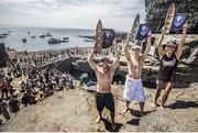 29 June 2014; Gary Hunt, centre, United Kingdom, celebrates with second place Steven LoBue, left, USA, and third place Jonathan Paredes, right, Mexico, after the third stop of the Red Bull Cliff Diving World Series, Inis Mor, Aran Islands, Co. Galway. Picture credit: Romina Amato / SPORTSFILE