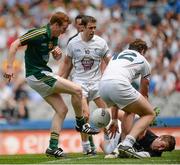 29 June 2014: Dalton McDonagh, Meath, has a shot on goal saved by Sean Hurley, 12, and Mark Donnellan, Kildare. Leinster GAA Football Senior Championship, Semi-Final, Kildare v Meath. Croke Park, Dublin. Picture credit: Piaras Ó Mídheach / SPORTSFILE