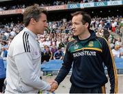 29 June 2014: Kildare manager Jason Ryan, left, shakes hands with Meath manager Mick O'Dowd after the game. Leinster GAA Football Senior Championship, Semi-Final, Kildare v Meath. Croke Park, Dublin. Picture credit: Piaras Ó Mídheach / SPORTSFILE