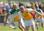 29 June 2014: PJ O'Connell, Antrim, in action against Ger Healion, Offaly. GAA Hurling All-Ireland Senior Championship, Round 1, Antrim v Offaly, Ballycastle, Co. Antrim. Picture credit: Oliver McVeigh / SPORTSFILE