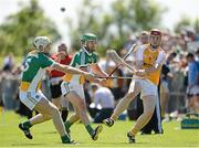 29 June 2014: Conor McCann, Antrim, in action against Kevin Brady and Shane Dooley, Offaly. GAA Hurling All-Ireland Senior Championship, Round 1, Antrim v Offaly, Ballycastle, Co. Antrim. Picture credit: Oliver McVeigh / SPORTSFILE