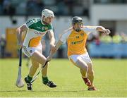 29 June 2014: Ciaran Clarke, Antrim, in action against Kevin Brady, Offaly. GAA Hurling All-Ireland Senior Championship, Round 1, Antrim v Offaly, Ballycastle, Co. Antrim. Picture credit: Oliver McVeigh / SPORTSFILE