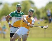 29 June 2014: Paul Shiels, Antrim, in action against Joe Bergin, Offaly. GAA Hurling All-Ireland Senior Championship, Round 1, Antrim v Offaly, Ballycastle, Co. Antrim. Picture credit: Oliver McVeigh / SPORTSFILE