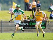 29 June 2014: Joe Bergin, Offaly, in action against Odhran McFadden, Antrim. GAA Hurling All-Ireland Senior Championship, Round 1, Antrim v Offaly, Ballycastle, Co. Antrim. Picture credit: Oliver McVeigh / SPORTSFILE