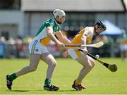 29 June 2014: Ciaran Clarke, Antrim, in action against Kevin Brady, Offaly. GAA Hurling All-Ireland Senior Championship, Round 1, Antrim v Offaly, Ballycastle, Co. Antrim. Picture credit: Oliver McVeigh / SPORTSFILE