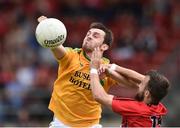 29 June 2014: Sean McWeeney, Leitrim, in action against Conor Laverty, Down. GAA Football All Ireland Senior Championship, Round 1B, Down v Leitrim, Páirc Esler, Newry, Co. Down. Picture credit: David Maher / SPORTSFILE