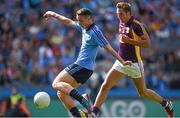 29 June 2014: Cormac Costello, Dublin, on his way to scoring his side's first goal despite the attention of Brian Malone, Wexford. Leinster GAA Football Senior Championship, Semi-Final, Dublin v Wexford. Croke Park, Dublin. Picture credit: Stephen McCarthy / SPORTSFILE