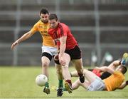 29 June 2014: Liam Doyle, Down, in action against Gavin Reynolds, Leitrim. GAA Football All Ireland Senior Championship, Round 1B, Down v Leitrim, Páirc Esler, Newry, Co. Down. Picture credit: David Maher / SPORTSFILE