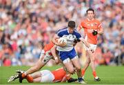 28 June 2014; Darren Hughes, Monaghan, beats the tackle of James Morgan, left, Ciaran McKeever, centre, and Tony Kernan, Armagh. Ulster GAA Football Senior Championship, Semi-Final, Armagh v Monaghan, St Tiernach's Park, Clones, Co. Monaghan. Picture credit: Ramsey Cardy / SPORTSFILE