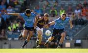 29 June 2014: Kevin O'Grady, Wexford, in action against Cian O'Sullivan and Nicky Devereux, Dublin. Leinster GAA Football Senior Championship, Semi-Final, Dublin v Wexford, Croke Park, Dublin. Picture credit: Ray McManus / SPORTSFILE