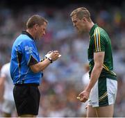 29 June 2014: Referee Rory Hickey notes the name of the Meath captain Kevin Reilly before issuing a yellow card. Leinster GAA Football Senior Championship, Semi-Final, Kildare v Meath, Croke Park, Dublin. Picture credit: Ray McManus / SPORTSFILE
