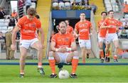 28 June 2014; Armagh captain Ciaran McKeever awaits the rest of his team-mates before the pre-match team photograph. Ulster GAA Football Senior Championship, Semi-Final, Armagh v Monaghan, St Tiernach's Park, Clones, Co. Monaghan. Picture credit: Ramsey Cardy / SPORTSFILE