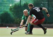 29 June 2014: Conor Harte, Ireland, in action against Mark Whatling, Wales. Men's International Hockey, Ireland v Wales, National Hockey Stadium, UCD, Belfield, Dublin. Picture credit; Ashleigh Fox / SPORTSFILE