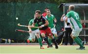 29 June 2014: Liam Brignull, Wales, in action against, from left, captain John Jackson, Michael Darling and Conor Harte, Ireland. Men's International Hockey, Ireland v Wales, National Hockey Stadium, UCD, Belfield, Dublin. Picture credit: Ashleigh Fox / SPORTSFILE
