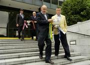 12 July 2006; Dublin manager Paul Caffrey, right, and Offaly manager Kevin Kilmurray hold the Delaney Cup while Peter Forde, Galway manager, left, and Mickey Moran, Mayo manager, walk behind holding the Nestor Cup at a photocall ahead of this weekend's Bank of Ireland Leinster and Connacht Senior Football Championship Finals. Bank of Ireland Head Office, Baggot Street, Dublin. Picture credit: Pat Murphy / SPORTSFILE