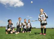 13 July 2006; Neil Carmody, right, shows off his hurling skills while David Woulfe, Paul Joyce, Shane Joyce and Gavin Ryan look on at the Limerick Cul Camp. The GAA Vhi Cul Camps have been extremely popular to date and are expected to attract a record 75,000 children over the summer months. The camps run through til August 25th. Patrickswell GAA Grounds, Patrickswell, Co. Limerick. Picture credit: Kieran Clancy / SPORTSFILE