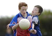 13 July 2006; Cormac Brodigan, age 12, from Kilineer, Co. Louth, left, is tackled by Cormac O'Brien, age 9, from Tinure, Co. Louth, at the Louth Cul Camp. The GAA Vhi Cul Camps have been extremely popular to date and are expected to attract a record 75,000 children over the summer months. The camps run through until August 25th. Monasterboice GAA Grounds, Monasterboice, Co. Louth. Photo by Sportsfile