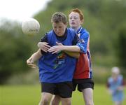13 July 2006; Andrew Gorman, age 11, from Ballymakenny, Co. Louth, left, is tackled by Cormac Brodigan, age, 12 from Kilineer, Co. Louth, at the Louth Cul Camp. The GAA Vhi Cul Camps have been extremely popular to date and are expected to attract a record 75,000 children over the summer months. The camps run through until August 25th. Monasterboice GAA Grounds, Monasterboice, Co. Louth. Photo by Sportsfile