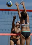 15 July 2006; Leanne Dignam, left, spikes the ball against Ollie Rossiter during their match. Coca-Cola Bray Beach Volleyball Event, Sand Area, Women's Round Robin, Dignam / P. Walsh v Kuncik / Rossiter, Bray Beach, Bray, Co. Wicklow. Picture credit: Brendan Moran / SPORTSFILE