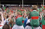 16 July 2006; Mayo supporters watch as Mayo captain David Heaney lifts the nestor cup. Bank of Ireland Connacht Senior Football Championship Final, Mayo v Galway, McHale Park, Castlebar, Co. Mayo. Picture credit: Damien Eagers / SPORTSFILE