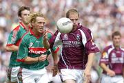 16 July 2006; Michael Donnellan, Galway, in action against Ciaran McDonald, Mayo. Bank of Ireland Connacht Senior Football Championship Final, Mayo v Galway, McHale Park, Castlebar, Co. Mayo. Picture credit: Pat Murphy / SPORTSFILE